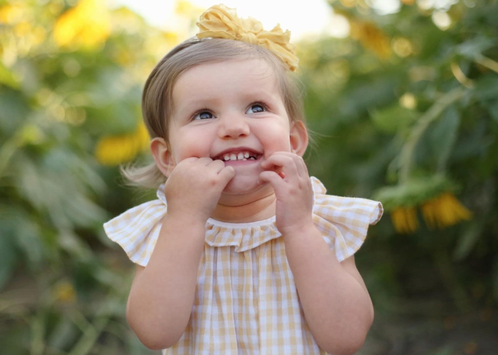 young toddler girl smiling for camera