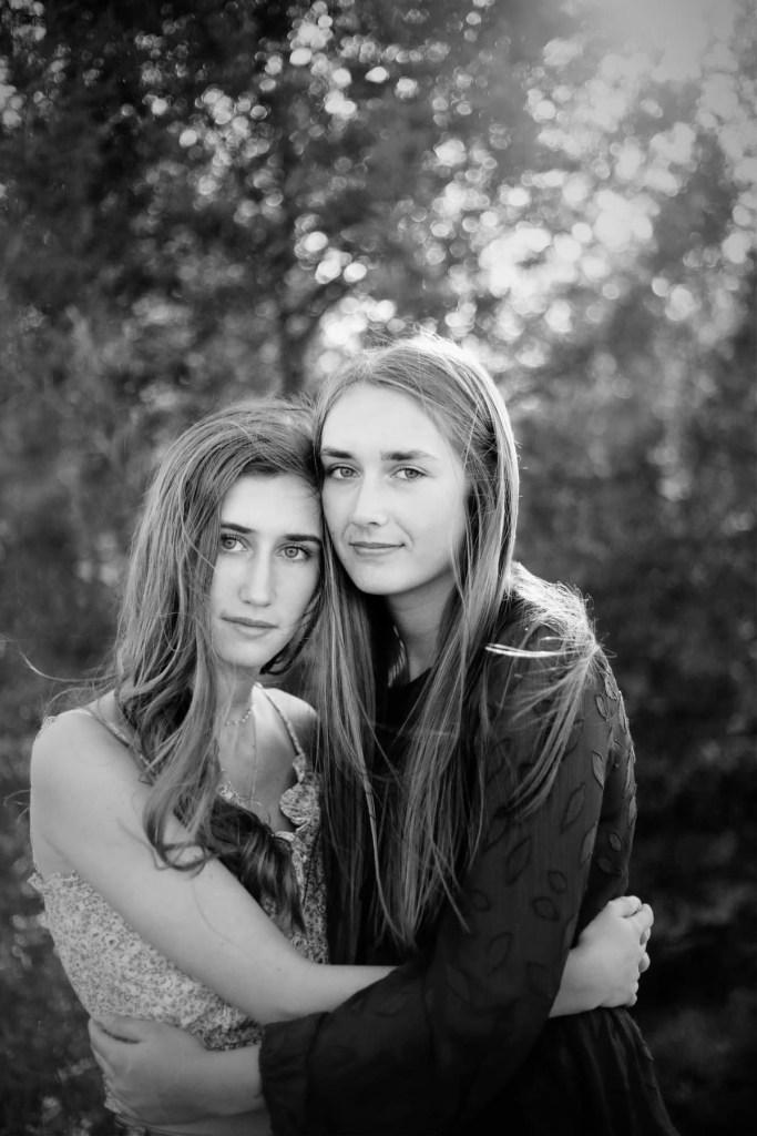 two girls posing side by side