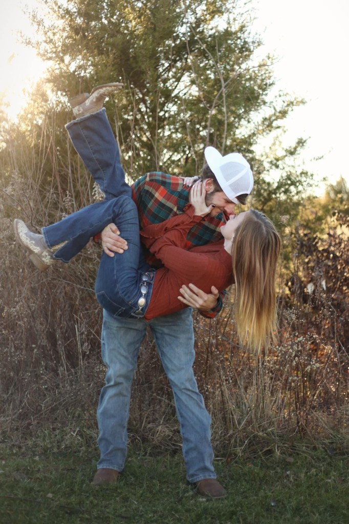 man holding women and dipping her while both laughing