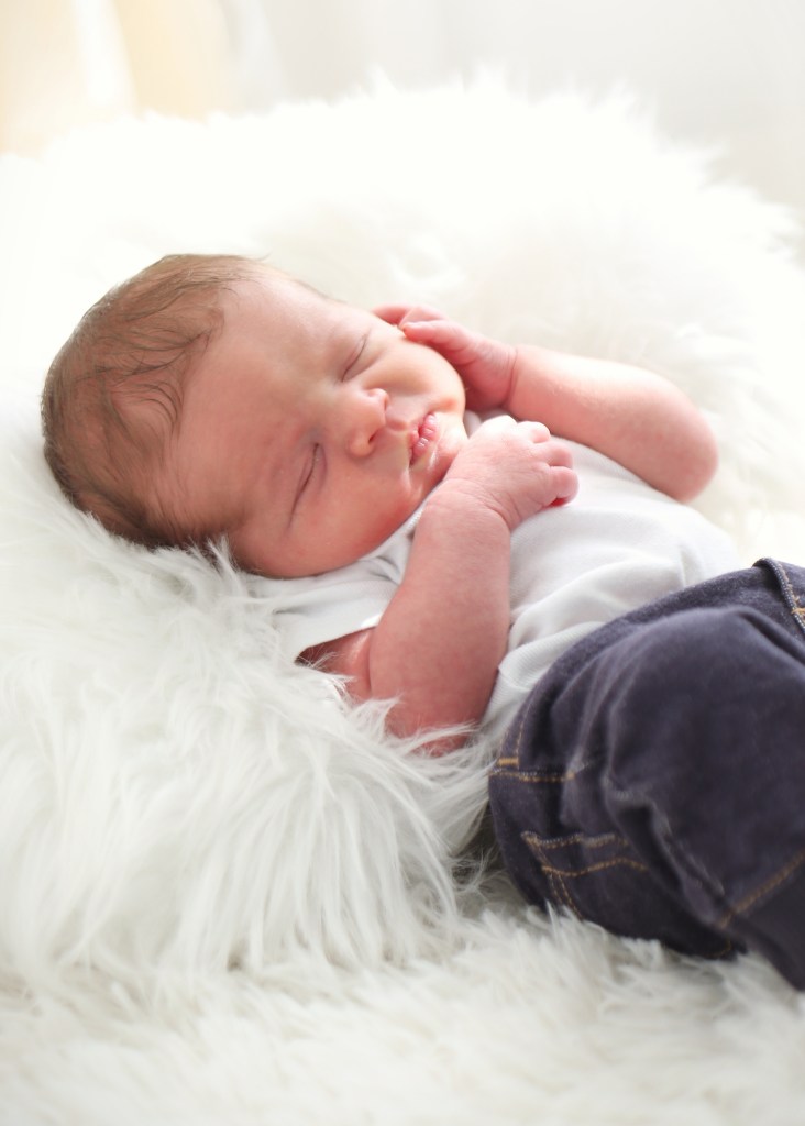 newborn baby on fuzzy soft blanket